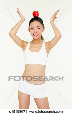 Sports Clothing, Standing, 18-19 Years, Healthy Eating, Fruit View Large Photo Image Stock Image - Sports Clothing, Standing, 18-19 Years, Healthy Eating, Fruit. Fotosearch