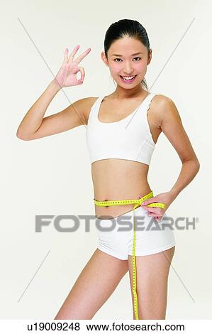 Standing, Portrait, 18-19 Years, Hand Sign, Dieting, Young Adult View Large Photo Image Stock Photo - Standing, Portrait, 18-19 Years, Hand Sign, Dieting, Young Adult. Fotosearch