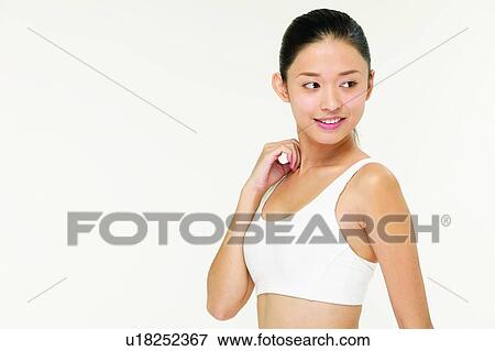 Stock Photo - Toothy Smile, Black Hair, Close-Up, Exercising, Confidence, Indoor. Fotosearch