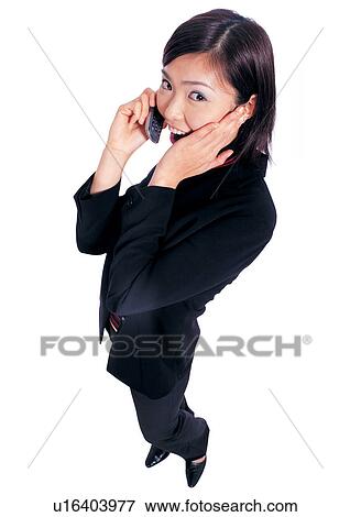 Stock Photo - business executive, executive, on the phone, indoors, hand on face. Fotosearch