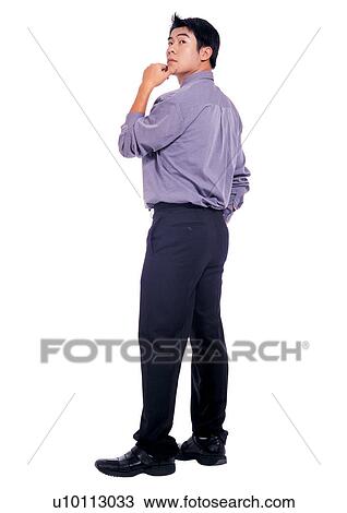 Stock Image - career, well dressed, standing, button down shirt, culture. Fotosearch