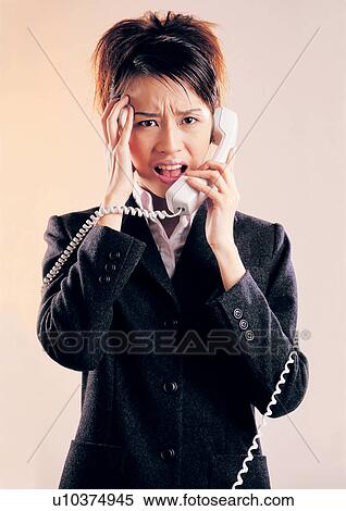 Stock Photography - hand on head, waist up, stress, business attitudes, career. Fotosearch