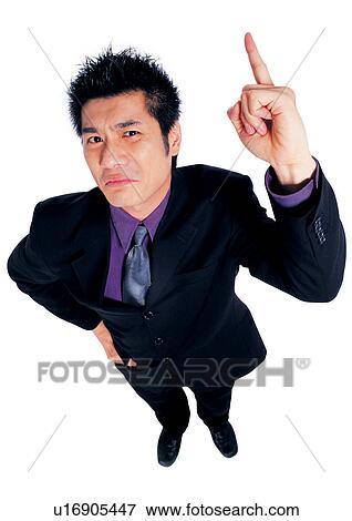 Stock Photo - pointing, business attitudes asian, young man, man only, business attitudes, asian. Fotosearch