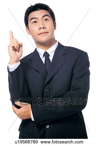 Stock Photo - well dressed, culture, young man, white background, business executive, career, asian. Fotosearch