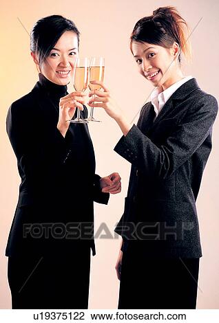 Stock Image - well dressed, happiness, fashion, waist up, style, culture, tossing. Fotosearch