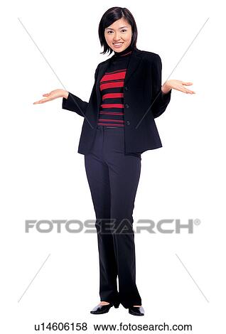 Stock Photo - woman only, toothy smile, business executive, standing, indoors, asian. Fotosearch