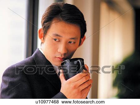 Stock Photo - indoor, confidence, holding, business in asia, day. Fotosearch