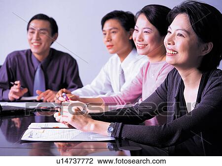 Stock Image - office chair, toothy smile, formal, business executive, mid adult men. Fotosearch