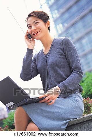 on the phone, connectivity, communication, asian ethnicity View Large Photo Image Stock Image - on the phone, connectivity, communication, asian ethnicity. Fotosearch