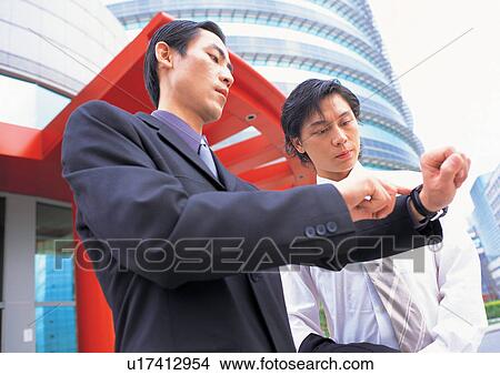 Picture - profession, waist up, watch, well dressed, outdoor. Fotosearch