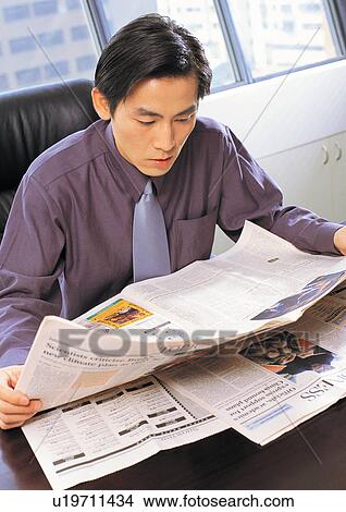 Picture - reading, tie, holding, window, career, business executive. Fotosearch