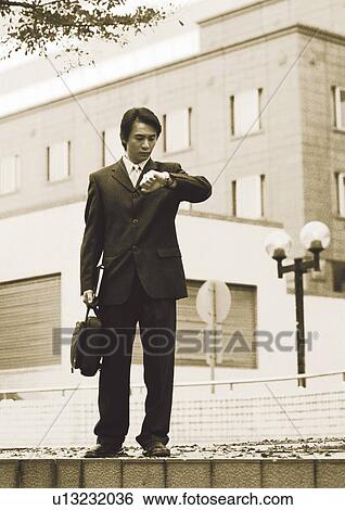 Stock Photograph - sepia, asian ethnicity, well dressed, business in asia, formal, suit. Fotosearch