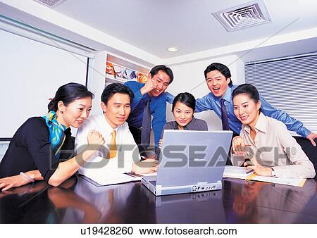 Stock Image - well dressed, business in asia, teamwork, asian ethnicity. Fotosearch