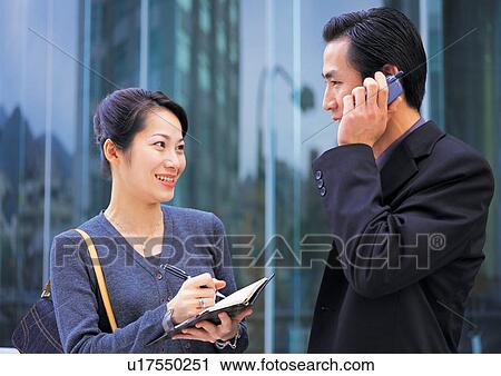 well dressed, communication, on the phone, asian ethnicity View Large Photo Image Stock Image - well dressed, communication, on the phone, asian ethnicity. Fotosearch
