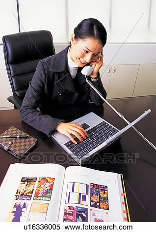 well-dressed, communication, on the phone, asian ethnicity View Large Photo Image Stock Photography - well-dressed, communication, on the phone, asian ethnicity. Fotosearch