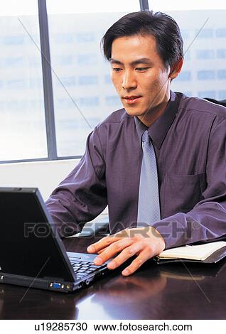 well dressed, smiling, business in asia, asian ethnicity View Large Photo Image Stock Image - well dressed, smiling, business in asia, asian ethnicity. Fotosearch
