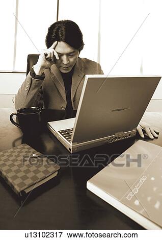 working, concentrating, black and white, telephone, books, culture, executive View Large Photo Image Stock Photo - working, concentrating, black and white, telephone, books, culture, executive. Fotosearch