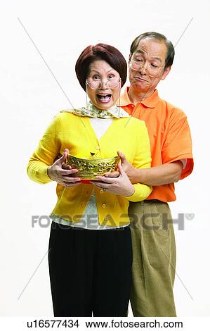 Picture - Asian Ethnicity, Cardigan, Brown Hair, Balding, Adults Only. Fotosearch