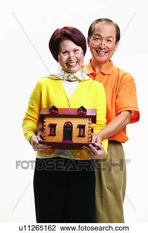 Stock Image - Asian Ethnicity, Cardigan, Brown Hair, Balding, Adults Only. Fotosearch