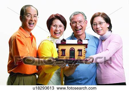 Stock Image - Asian Ethnicity, Cardigan, Brown Hair, Balding, Adults Only. Fotosearch