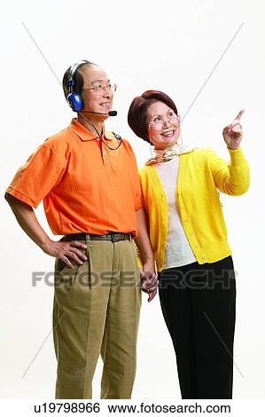 Stock Photograph - Asian Ethnicity, Cardigan, Brown Hair, Balding, Adults Only. Fotosearch