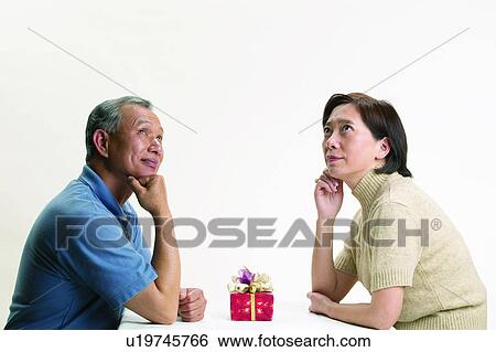 Stock Photograph - Asian Ethnicity, Casual Clothing, Brown Hair, Adults Only. Fotosearch