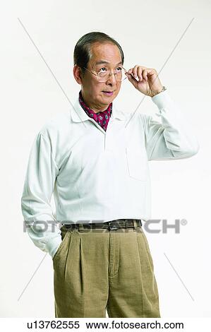 Black Hair, Elderly, Neckerchief, Eyeglasses, Polo Shirt, Casual Clothing View Large Photo Image Stock Photography - Black Hair, Elderly, Neckerchief, Eyeglasses, Polo Shirt, Casual Clothing. Fotosearch