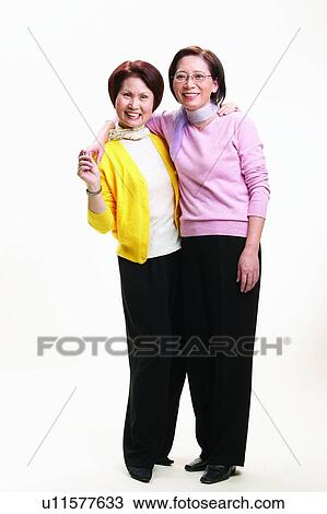 Stock Image - Casual Clothing, Arm Around, Cardigan, Brown Hair, Asian Ethnicity, Adults Only. Fotosearch