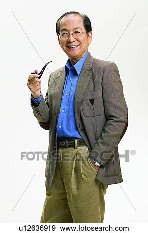 Stock Photo - Casual Clothing, Elderly, Indoor, Looking At Camera, Belt, Eyeglasses, Coat. Fotosearch