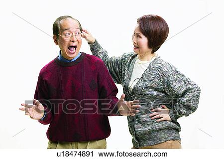 Stock Image - Close-Up, Asian Ethnicity, Cardigan, Brown Hair, Balding, Adults Only. Fotosearch