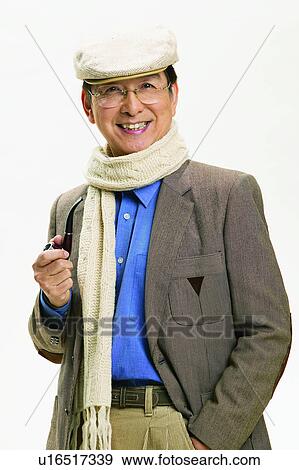 Stock Photo - Coat, Asian, Smoking Issues, Elderly, One Mature Man Only, Toothy Smile, Pipe. Fotosearch