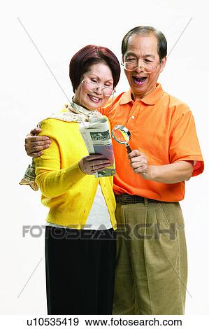 Stock Photo - Elderly, Brown Hair, Short Hair, Polo Shirt, Mature Women, Looking Down. Fotosearch