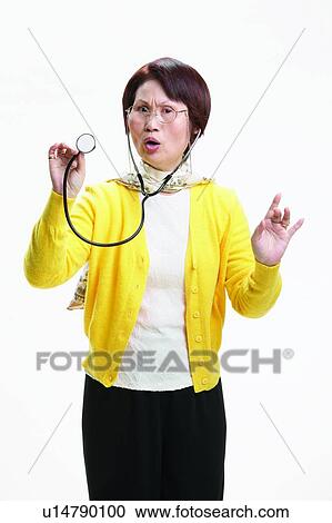 Stock Image - Holding, Medical Equipment, Scarf, Female Doctor, Doctor, One Person, Mouth Open. Fotosearch