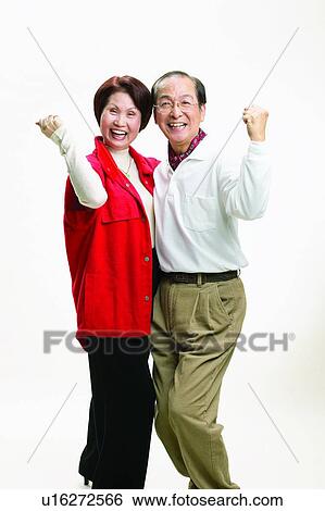 Stock Photograph - Indoor, Mature Adult, Mature Women, Polo, Looking At Camera, Brown Hair, Laughing. Fotosearch