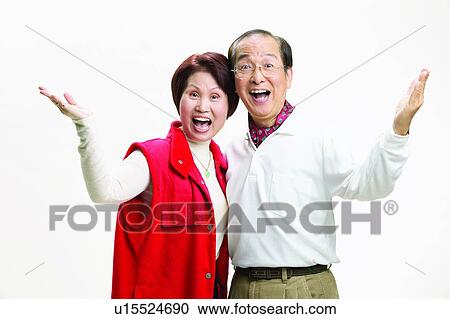 Stock Image - Indoor, Portrait, Short Hair, Eastern, Mature Couple. Fotosearch
