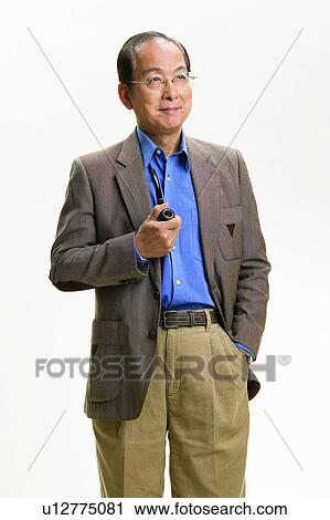 Stock Image - Lifestyles, One Person, Pipe, Button Down Shirt, Balding, Smoking. Fotosearch