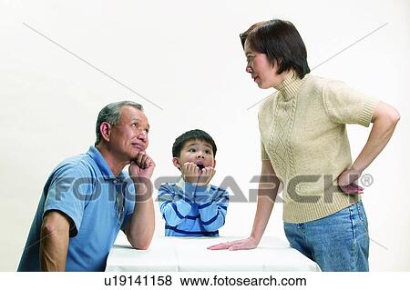 Stock Photo - Looking Up, Mature Men, Indoor, Looking At Each Other, Waist-Up. Fotosearch