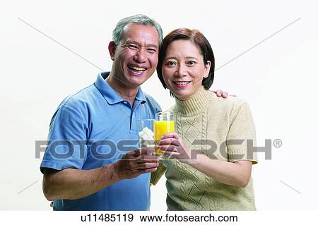 Refreshment, Close-Up, Smiling, Freshness, Asian, Asian Ethnicity View Large Photo Image Stock Photo - Refreshment, Close-Up, Smiling, Freshness, Asian, Asian Ethnicity. Fotosearch