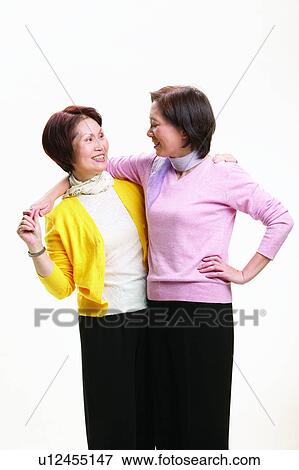 Three-Quarter Length, Brown Hair, Elderly, Short Hair, Looking At Each Other, Toothy Smile, Lifestyles View Large Photo Image Stock Photo - Three-Quarter Length, Brown Hair, Elderly, Short Hair, Looking At Each Other, Toothy Smile, Lifestyles. Fotosearch