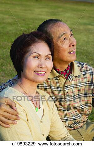 Arm Around, Button Down Shirt, Brown Hair, Asian Ethnicity, Adults Only View Large Photo Image Stock Photo - Arm Around, Button Down Shirt, Brown Hair, Asian Ethnicity, Adults Only. Fotosearch