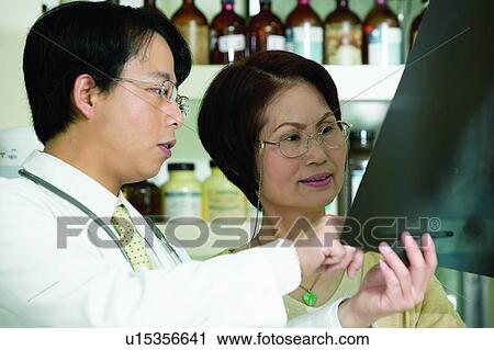 Stock Image - Asian Ethnicity, Bottle, Adults Only. Fotosearch