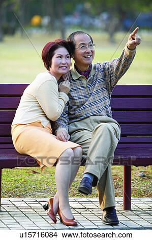 Picture - Asian Ethnicity, Brown Hair, Black Hair, Bench, Adults Only. Fotosearch