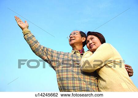 Stock Image - Asian Ethnicity, Button Down Shirt, Brown Hair, Blue, Adults Only. Fotosearch