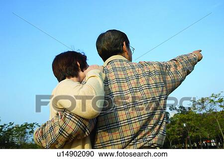 Stock Image - Asian Ethnicity, Button Down Shirt, Brown Hair, Blue, Adults Only. Fotosearch