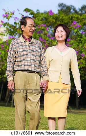 Asian Ethnicity, Button Down Shirt, Brown Hair, Belt, Adults Only View Large Photo Image Stock Image - Asian Ethnicity, Button Down Shirt, Brown Hair, Belt, Adults Only. Fotosearch