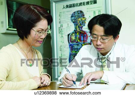 Asian Ethnicity, Button Down Shirt, Brown Hair, Black Hair, Adults Only View Large Photo Image Stock Photo - Asian Ethnicity, Button Down Shirt, Brown Hair, Black Hair, Adults Only. Fotosearch