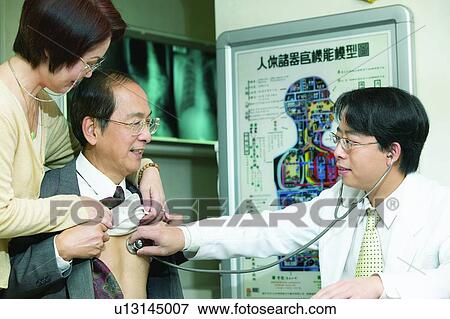 Stock Photo - Asian Ethnicity, Button Down Shirt, Black Hair, Adults Only. Fotosearch