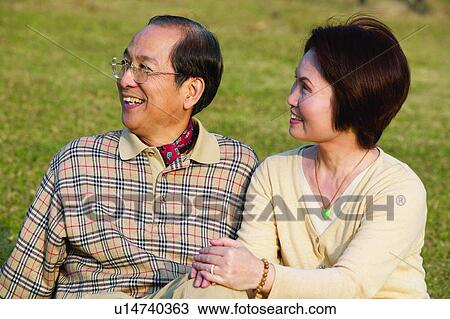Stock Image - Asian Ethnicity, Casual Clothing, Button Down Shirt, Brown Hair, Adults Only. Fotosearch