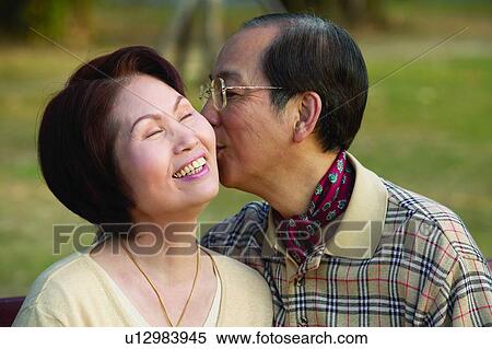 Asian Ethnicity, Casual Clothing, Button Down Shirt, Brown Hair, Adults Only View Large Photo Image Stock Photography - Asian Ethnicity, Casual Clothing, Button Down Shirt, Brown Hair, Adults Only. Fotosearch