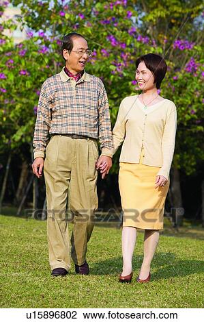 Button Down Shirt, Garden, Walking, Skirt, Toothy Smile, Casual Clothing, Affectionate View Large Photo Image Stock Image - Button Down Shirt, Garden, Walking, Skirt, Toothy Smile, Casual Clothing, Affectionate. Fotosearch